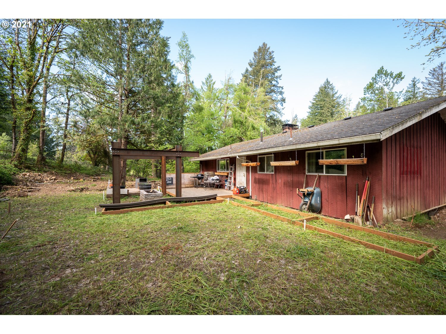 22514 South Redland Road Estacada, OR 97023 - Photo 25 of 28 a view of a house with backyard sitting area and garden