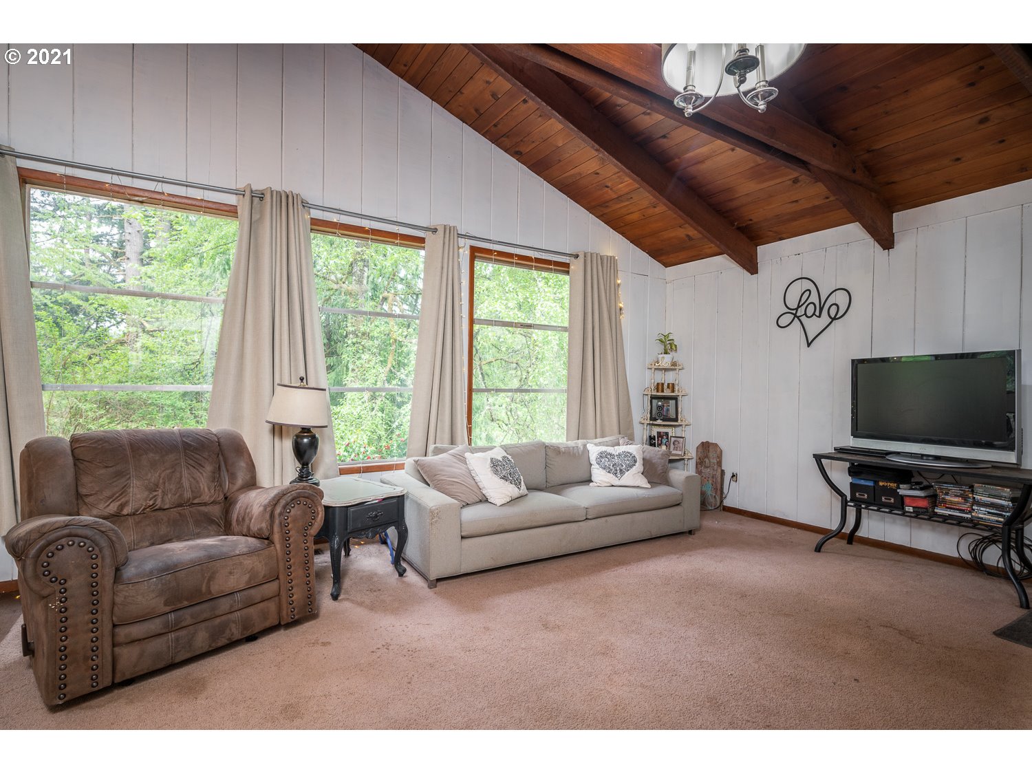 22514 South Redland Road Estacada, OR 97023 - Photo 4 of 28 a living room with furniture and a flat screen tv