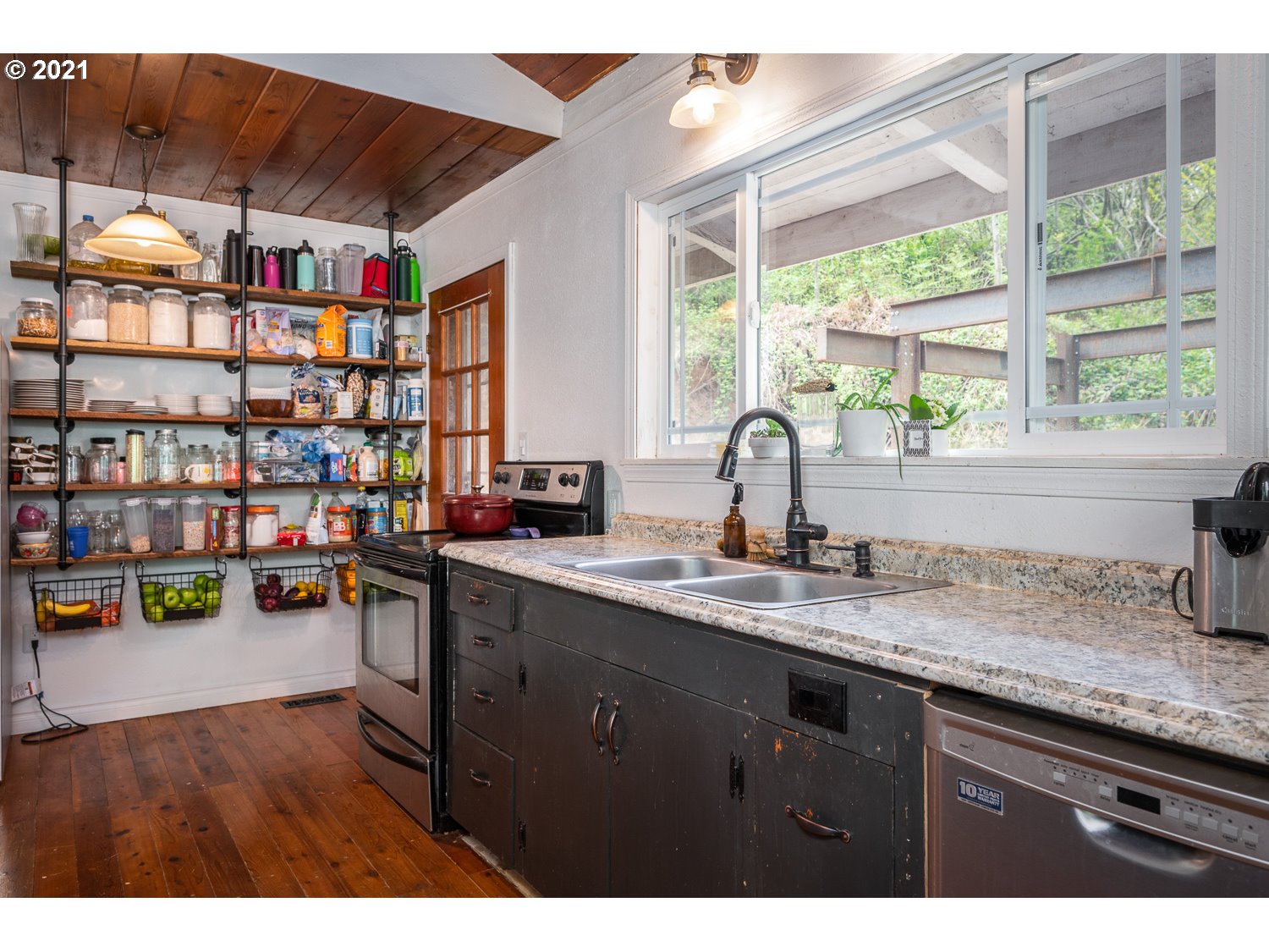 22514 South Redland Road Estacada, OR 97023 - Photo 9 of 28 a open kitchen with stainless steel appliances granite countertop a sink dishwasher and cabinets with wooden floor