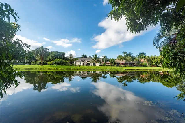 a view of a lake with houses in the back