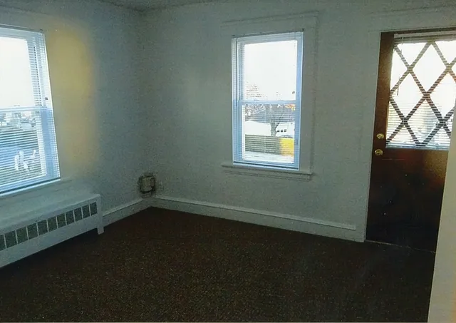 a bathroom with a tub and shower