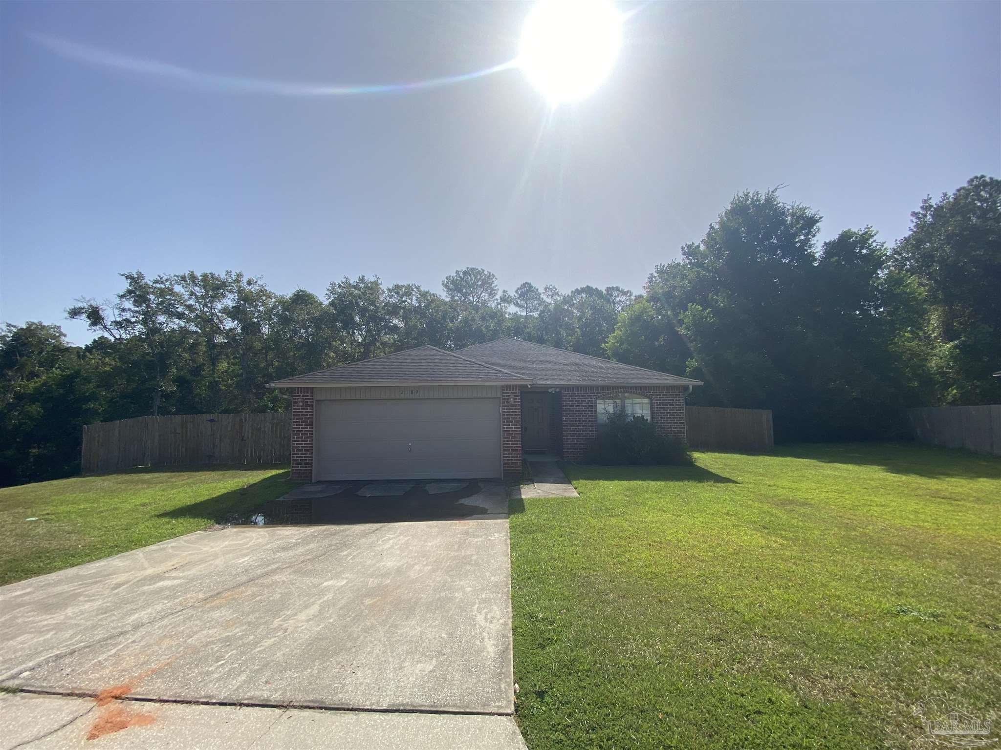 a view of a backyard with green space