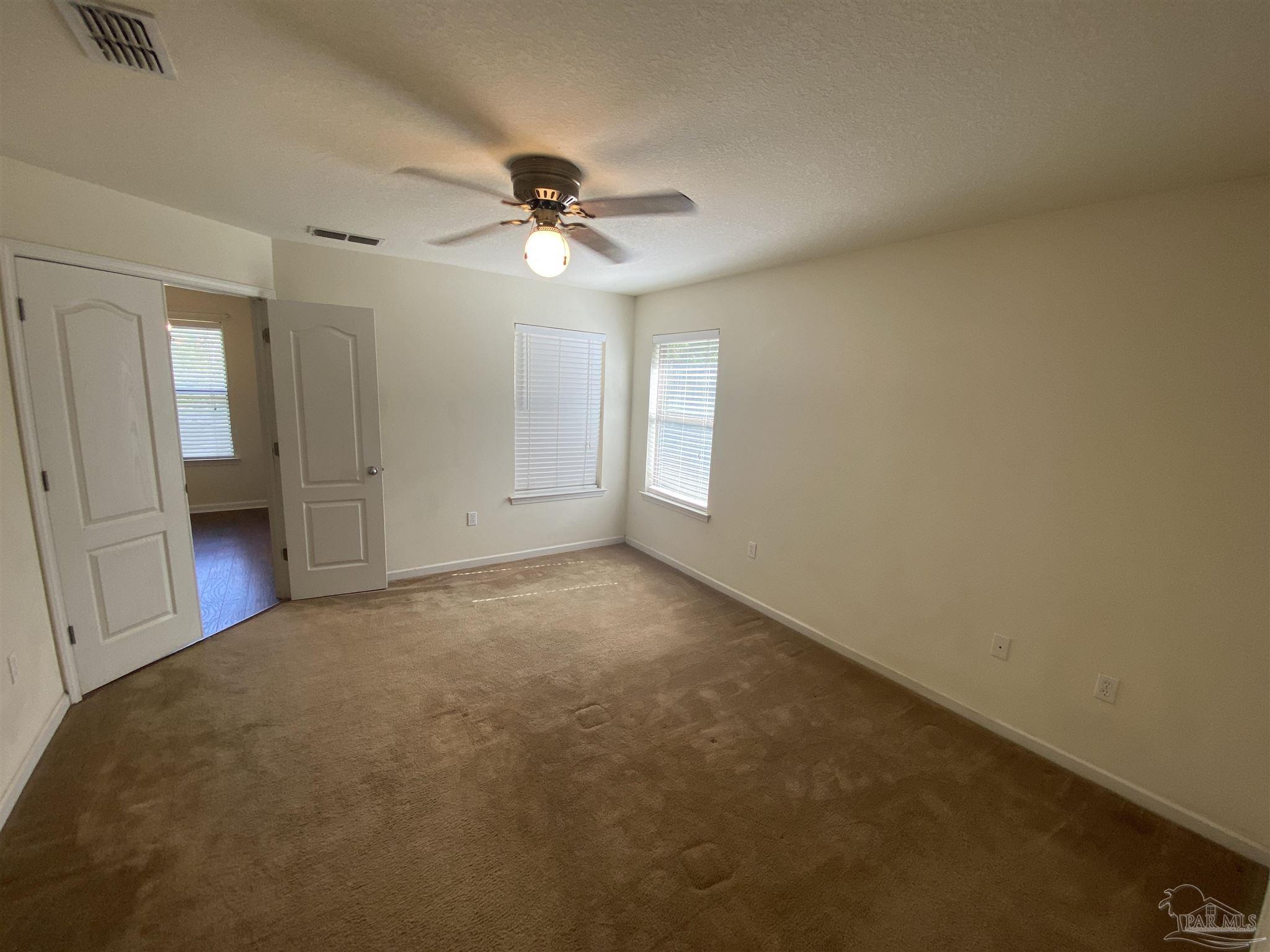 2189 Liberty Loop Road Cantonment, FL 32533 - Photo 13 of 25 a view of empty room with window and ceiling fan
