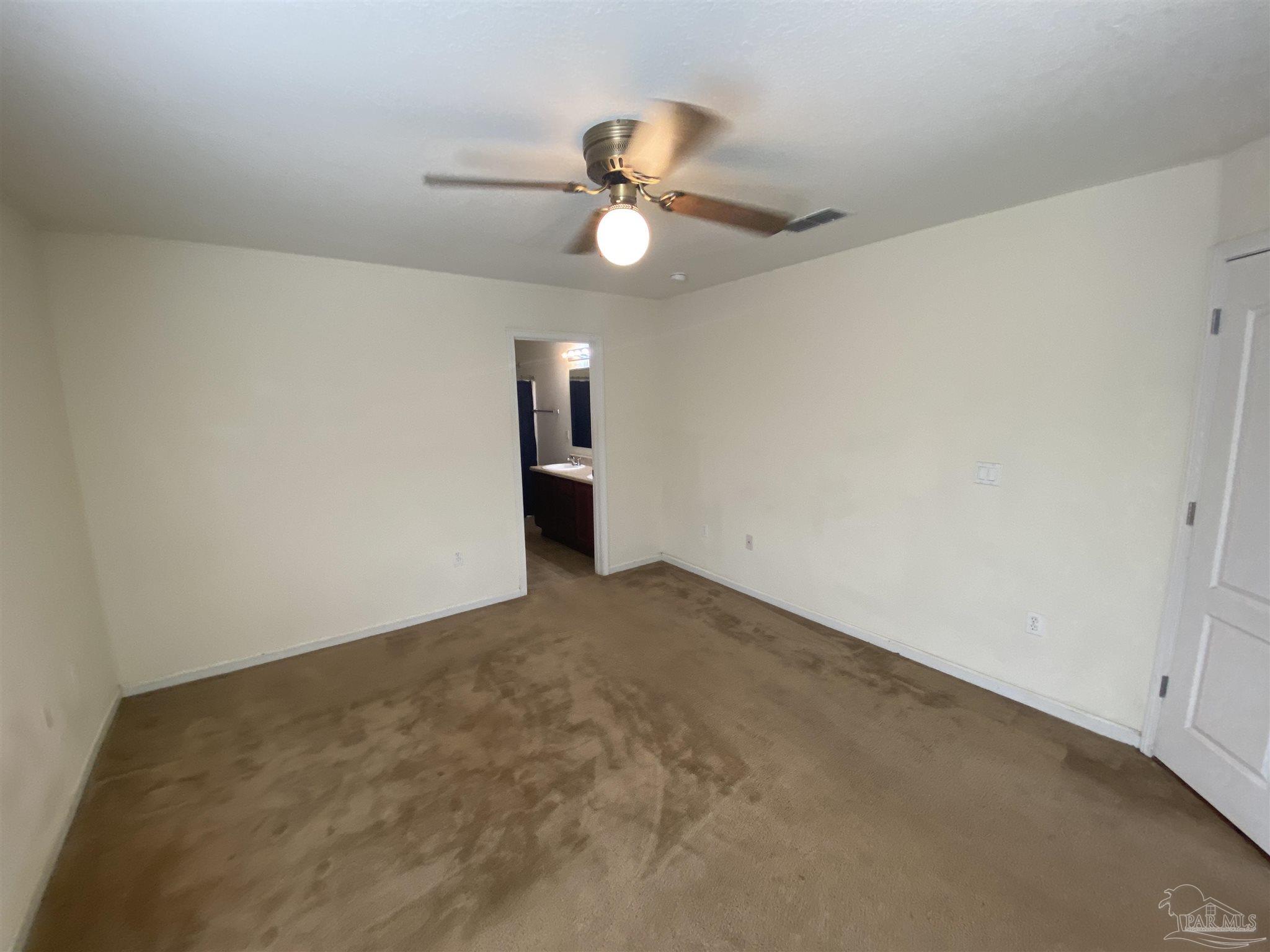 2189 Liberty Loop Road Cantonment, FL 32533 - Photo 14 of 25 a view of an empty room and a ceiling fan