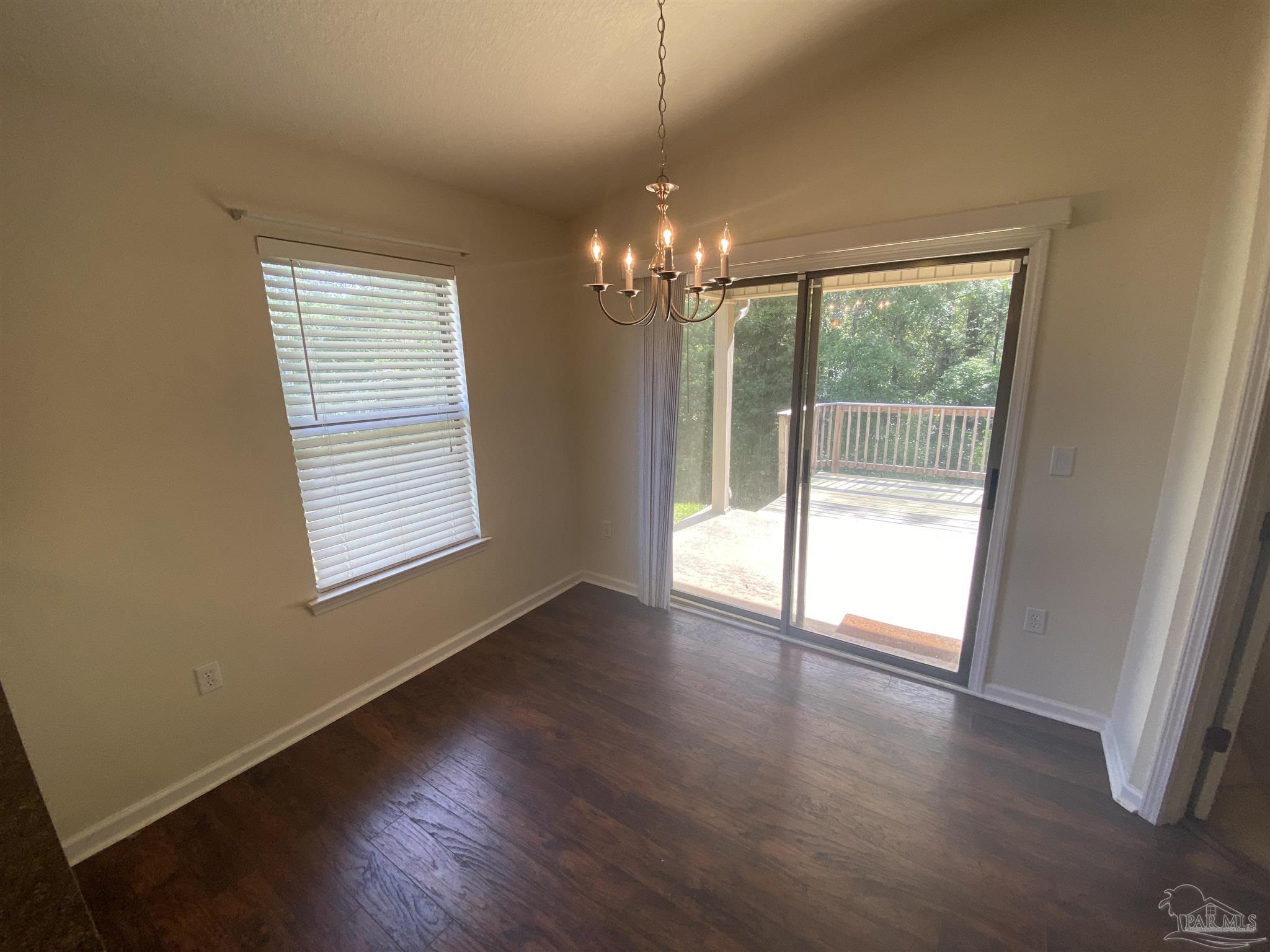 2189 Liberty Loop Road Cantonment, FL 32533 - Photo 25 of 25 a view of an empty room with wooden floor and a window