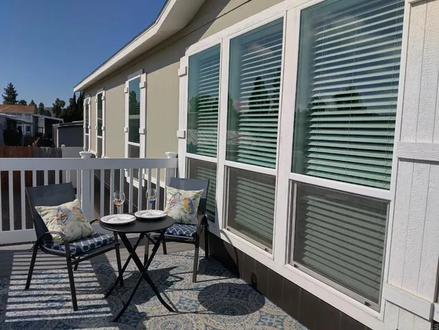 a view of a chairs and tables in the balcony