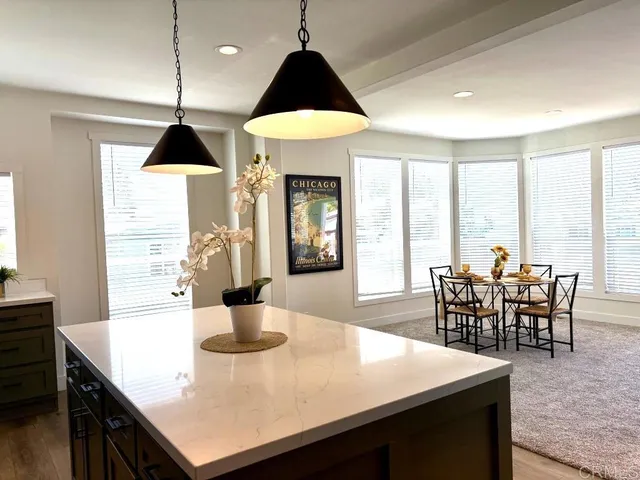 a view of a dining room with furniture window and outside view