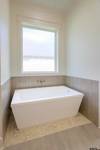 a bathroom with a sink vanity and mirror