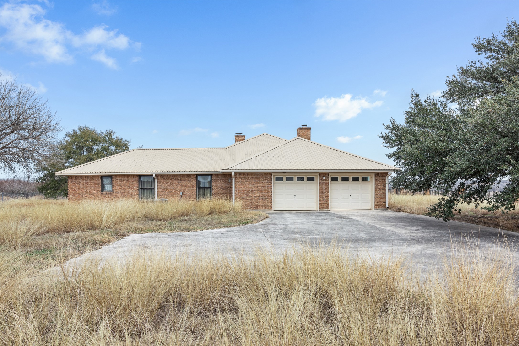 2884 Political Road Lockhart, TX 78644 - Photo 12 of 38 a front view of a house with a yard