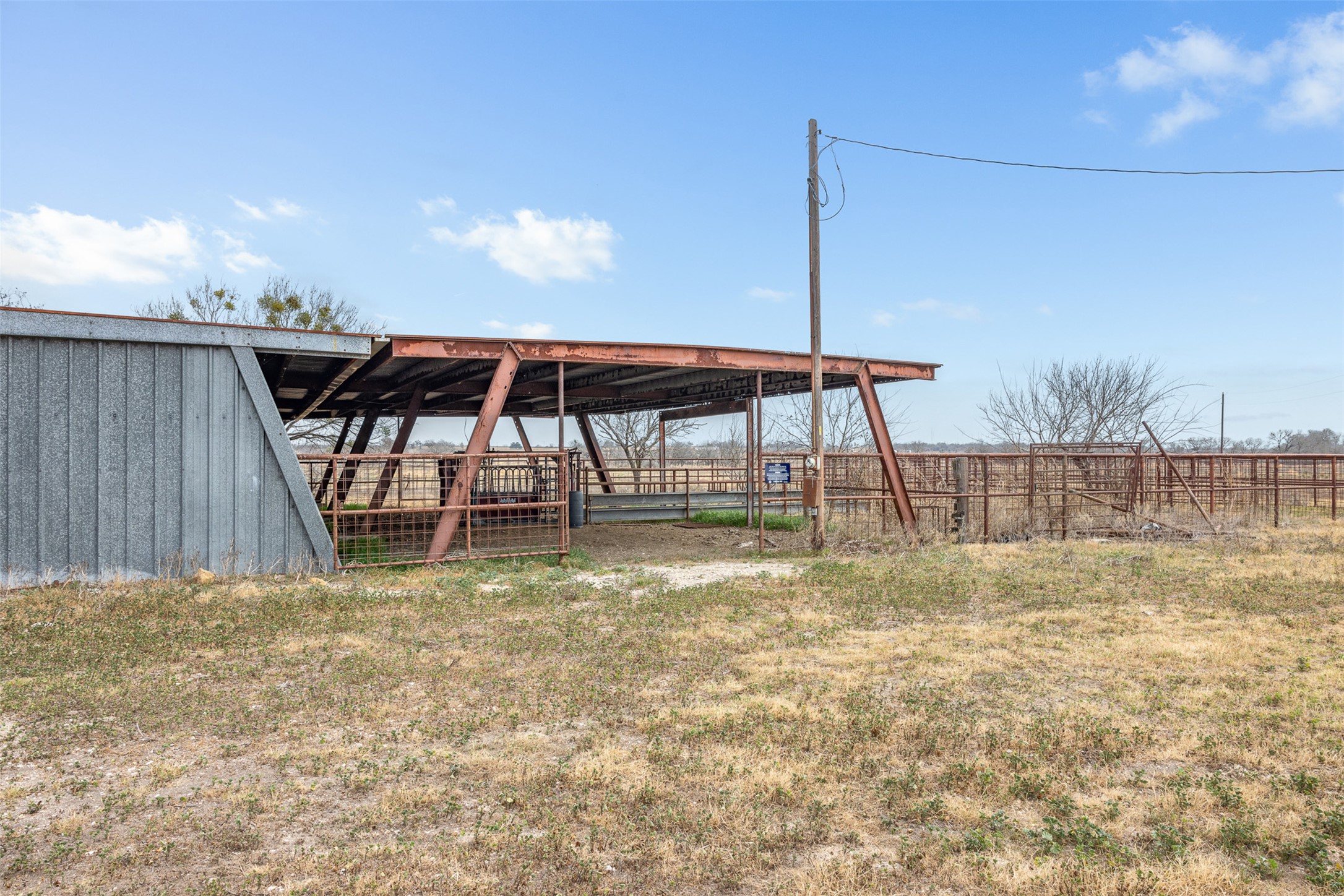 2884 Political Road Lockhart, TX 78644 - Photo 17 of 38 a backyard of a house with table and chairs