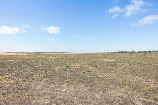 a view of a yard with an ocean view