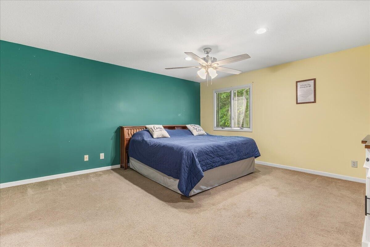 2522 Cindy Street Athens, TN 37303 - Photo 17 of 36 a spacious bedroom with a bed and a ceiling fan