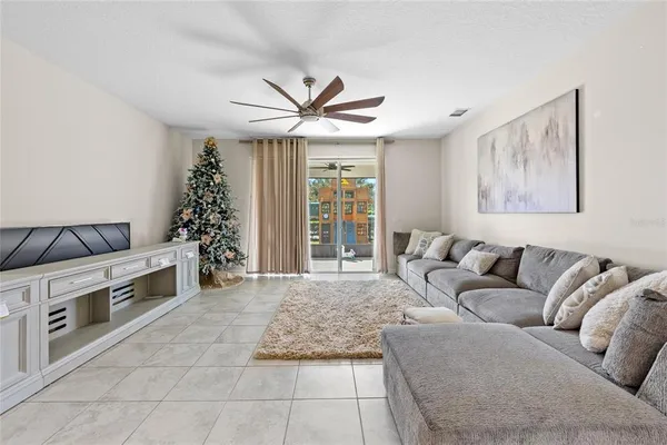 a living room with furniture and a large window