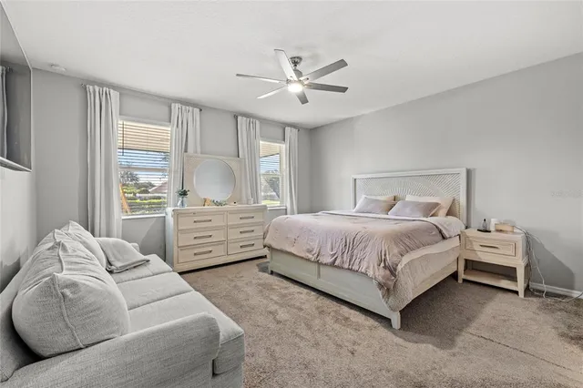 a bedroom with bed and window