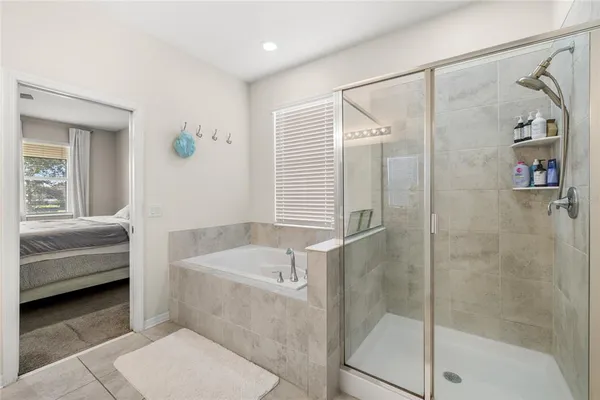 a bathroom with a tub and a shower