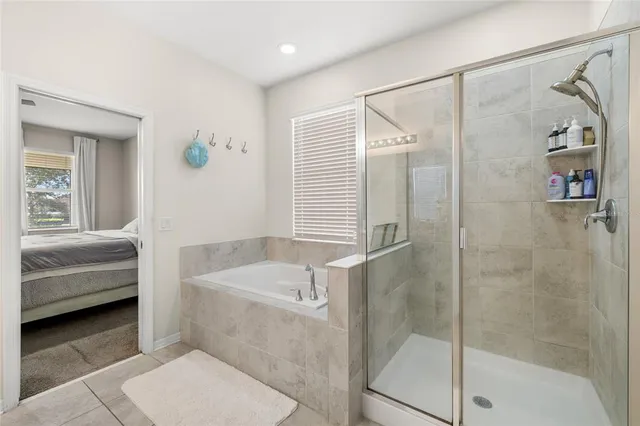 a bathroom with a tub and a shower