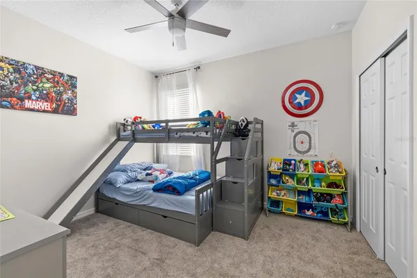 a bathroom with a sink vanity and a toilet