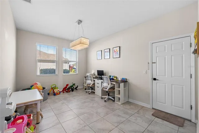 a bedroom with furniture and a window