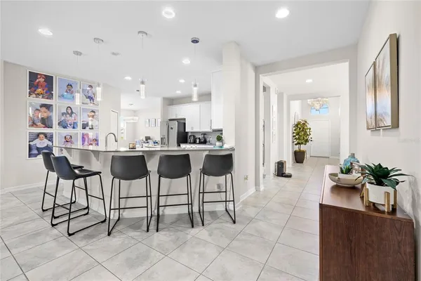 a kitchen with stainless steel appliances kitchen island granite countertop a sink and cabinets