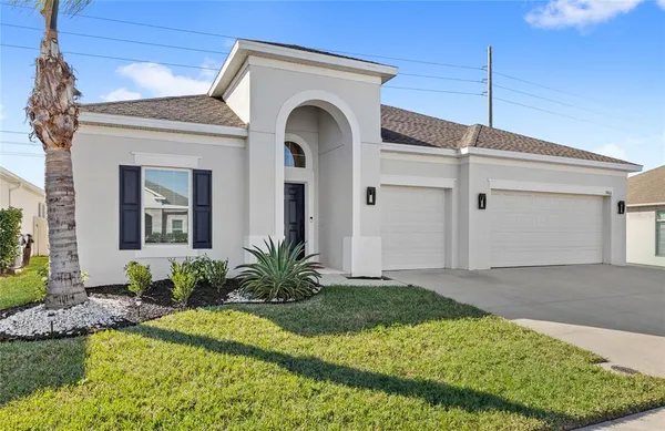 a front view of a house with garage
