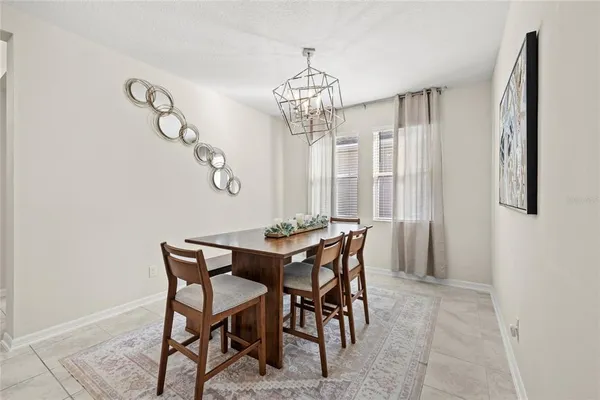 a view of a dining room with furniture and window