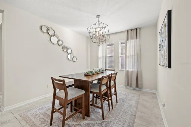 a view of a dining room with furniture and window