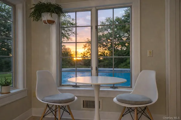 a view of a livingroom with furniture and a window