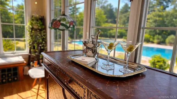 a view of a room with furniture and window