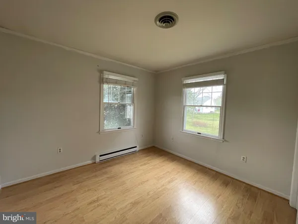 an empty room with a empty space and a ceiling fan