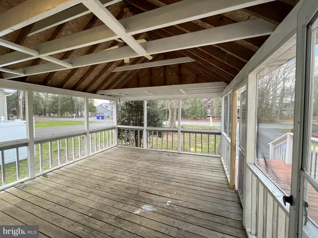 a view of balcony with wooden floor
