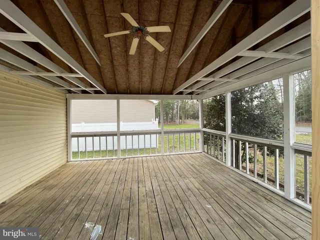 a view of a balcony with wooden floor