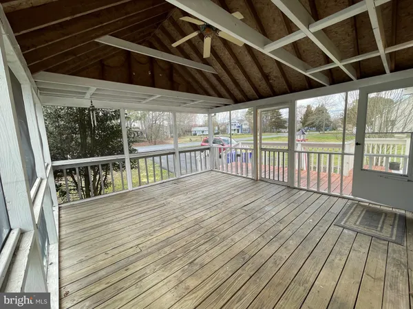 a view of a balcony with wooden floor