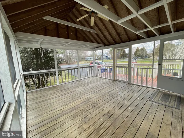a view of a balcony with wooden floor
