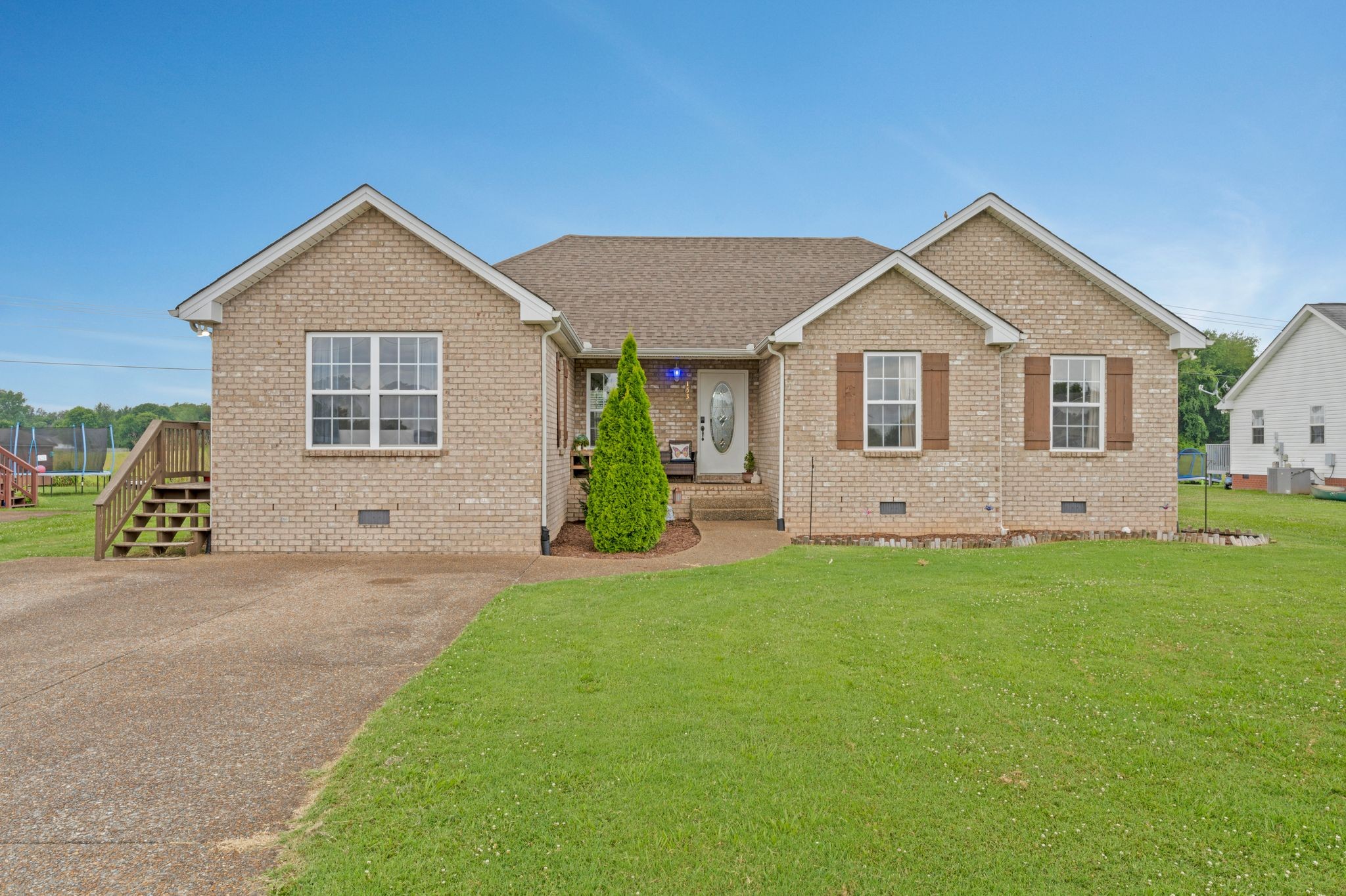 153 Cornerstone Boulevard Portland, TN 37148 - Photo 1 of 30 a view of a house with a yard and garage