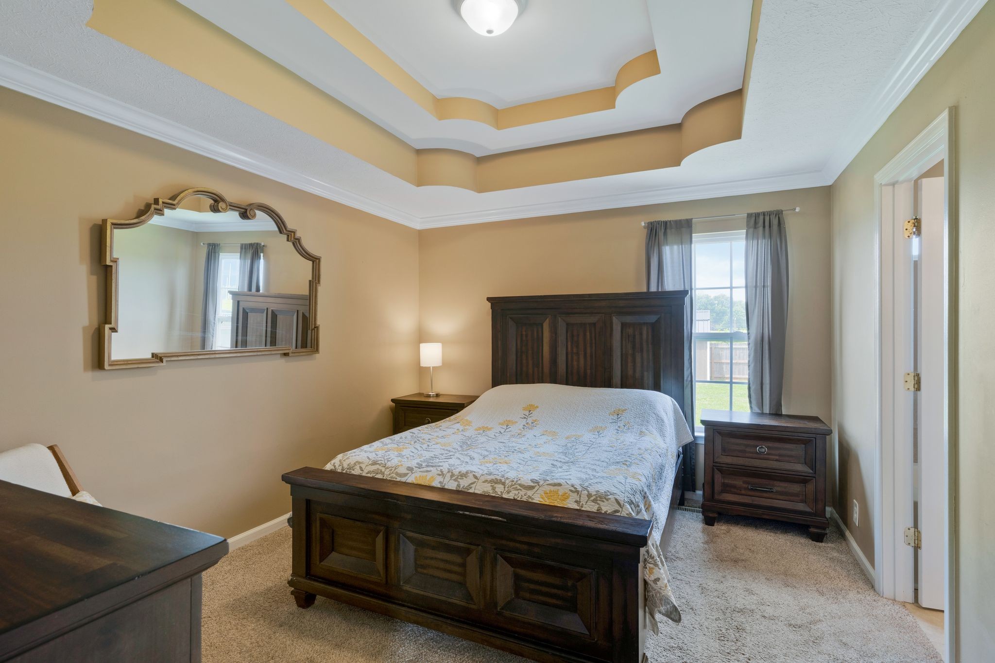 153 Cornerstone Boulevard Portland, TN 37148 - Photo 17 of 30 a bedroom with a bed and a dresser