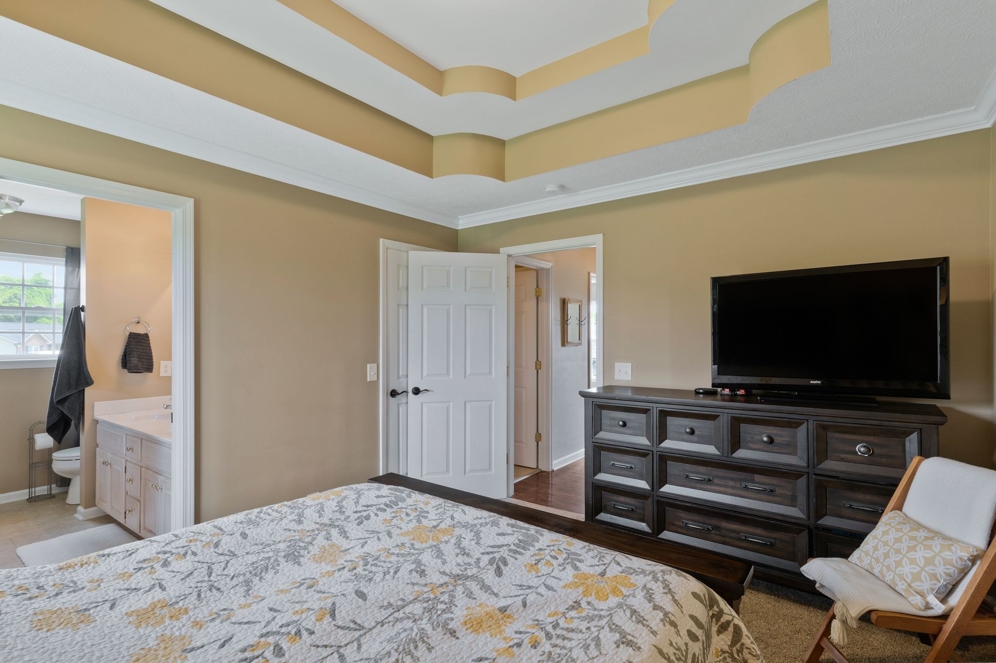 153 Cornerstone Boulevard Portland, TN 37148 - Photo 18 of 30 a bedroom with a bed and a flat screen tv