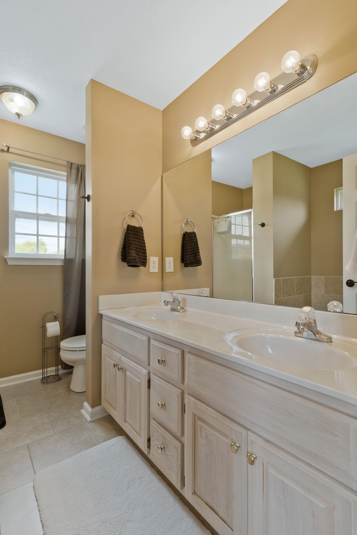 153 Cornerstone Boulevard Portland, TN 37148 - Photo 19 of 30 a spacious bathroom with double sink a mirror and a toilet