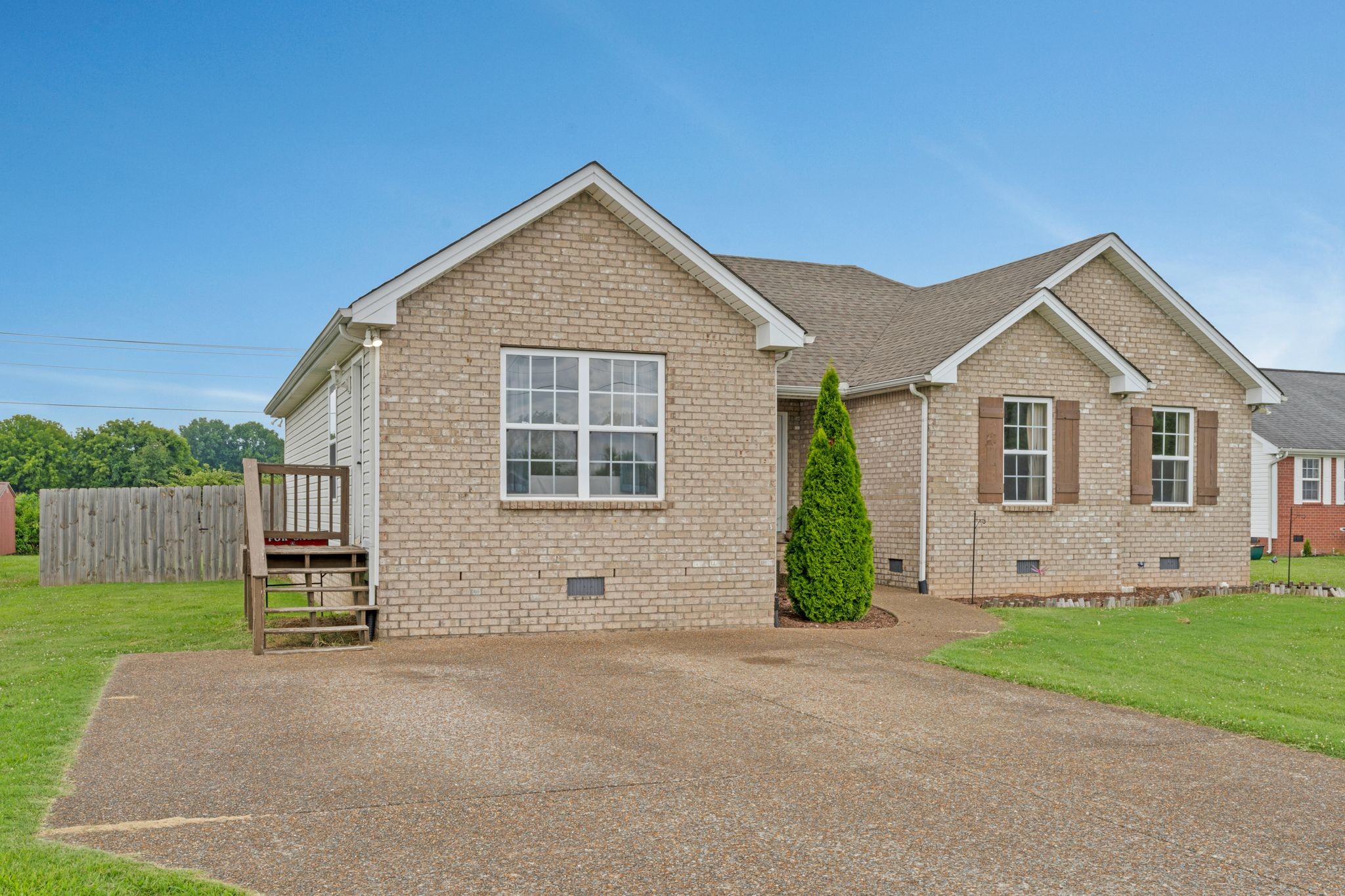 153 Cornerstone Boulevard Portland, TN 37148 - Photo 2 of 30 a view of a house with a yard and garage