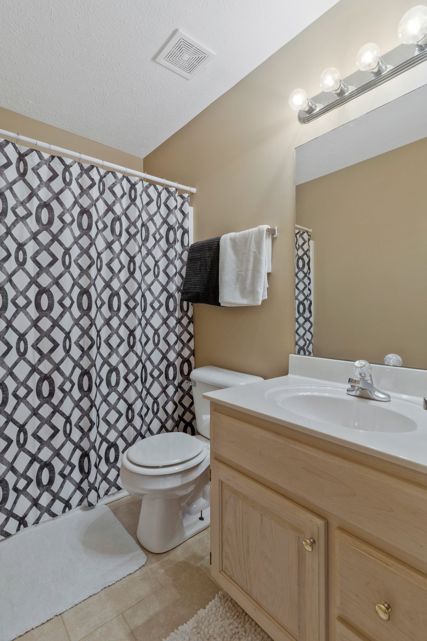 153 Cornerstone Boulevard Portland, TN 37148 - Photo 22 of 30 a bathroom with a sink toilet vanity and mirror