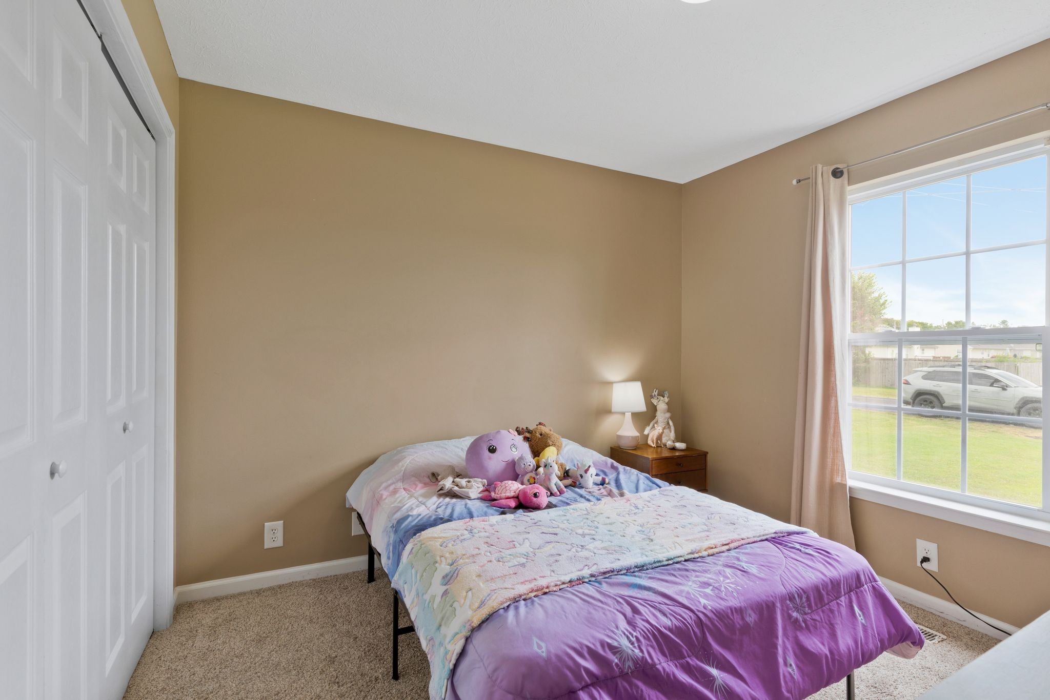 153 Cornerstone Boulevard Portland, TN 37148 - Photo 23 of 30 a bedroom with a bed and a window