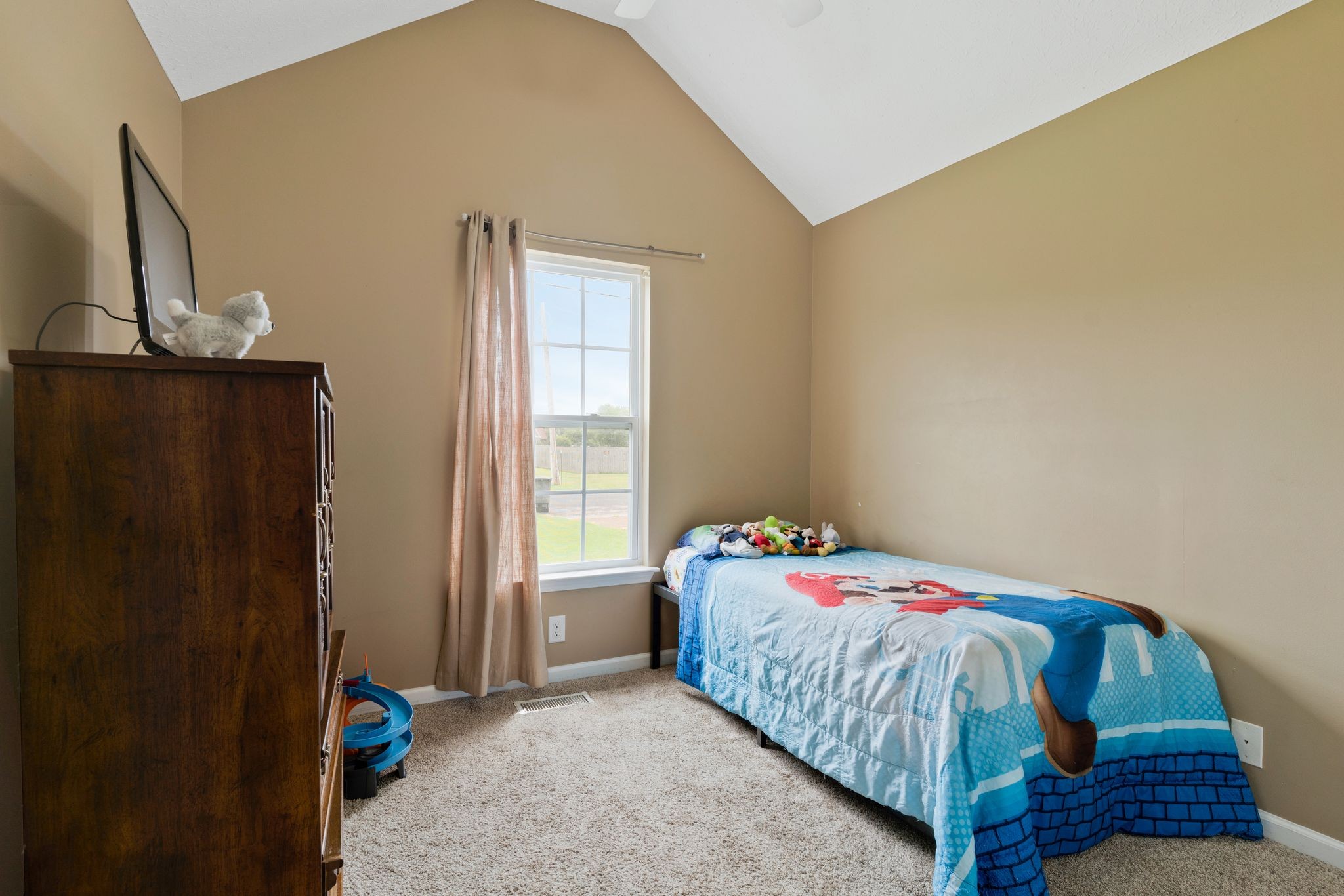 153 Cornerstone Boulevard Portland, TN 37148 - Photo 25 of 30 a bedroom with a bed and a window