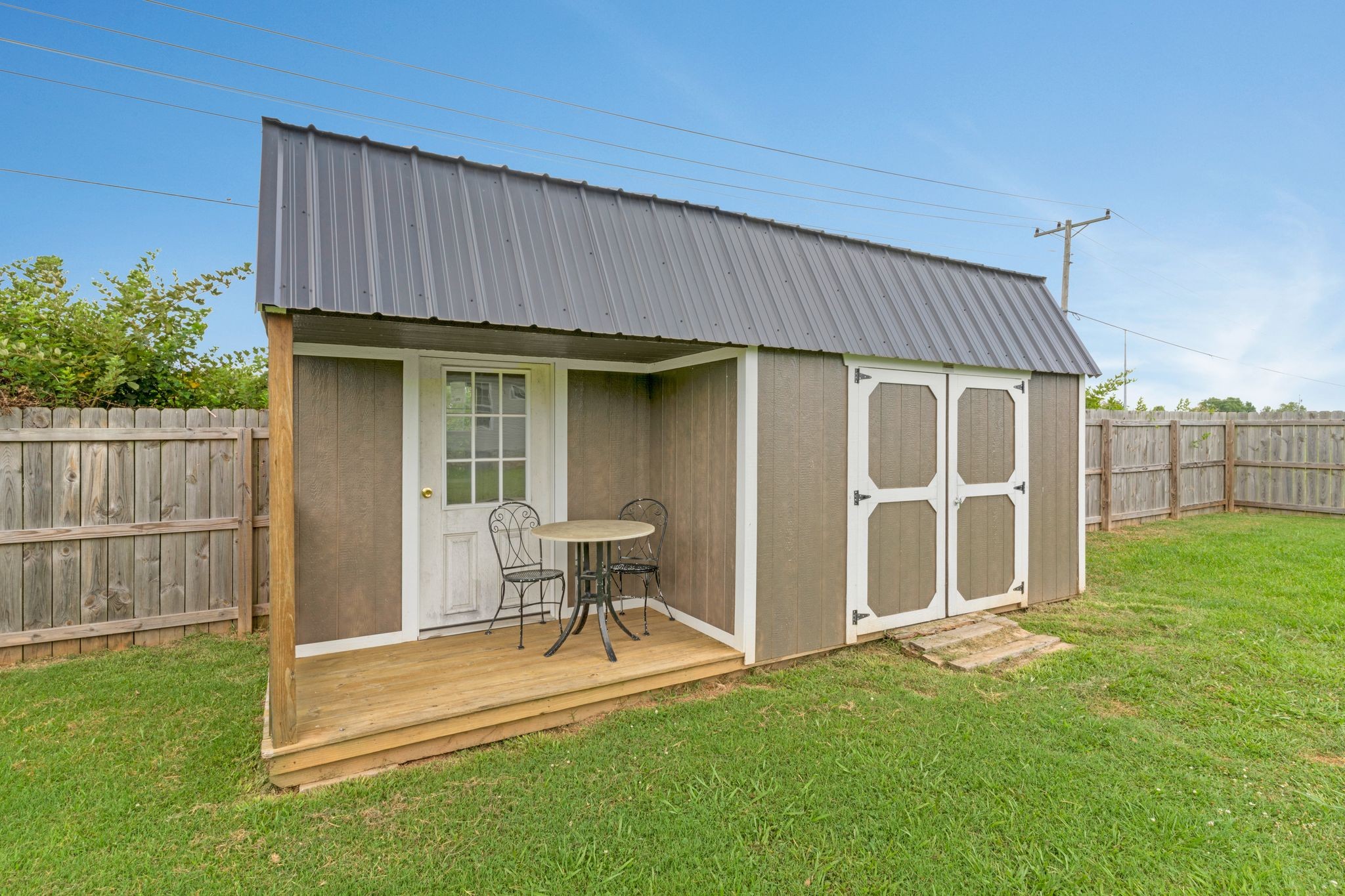 153 Cornerstone Boulevard Portland, TN 37148 - Photo 29 of 30 a backyard of a house with table and chairs
