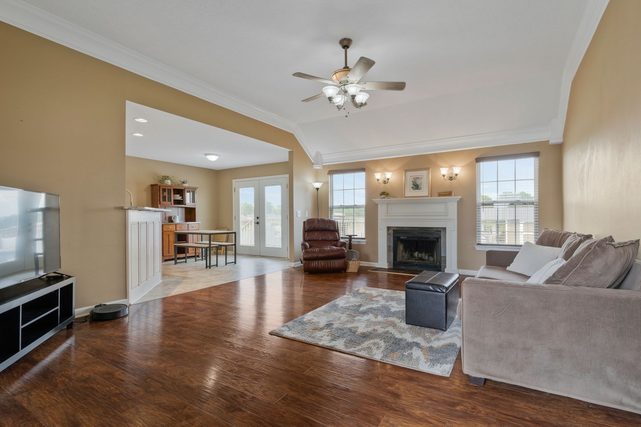 153 Cornerstone Boulevard Portland, TN 37148 - Photo 5 of 30 a living room with furniture a fireplace and a flat screen tv