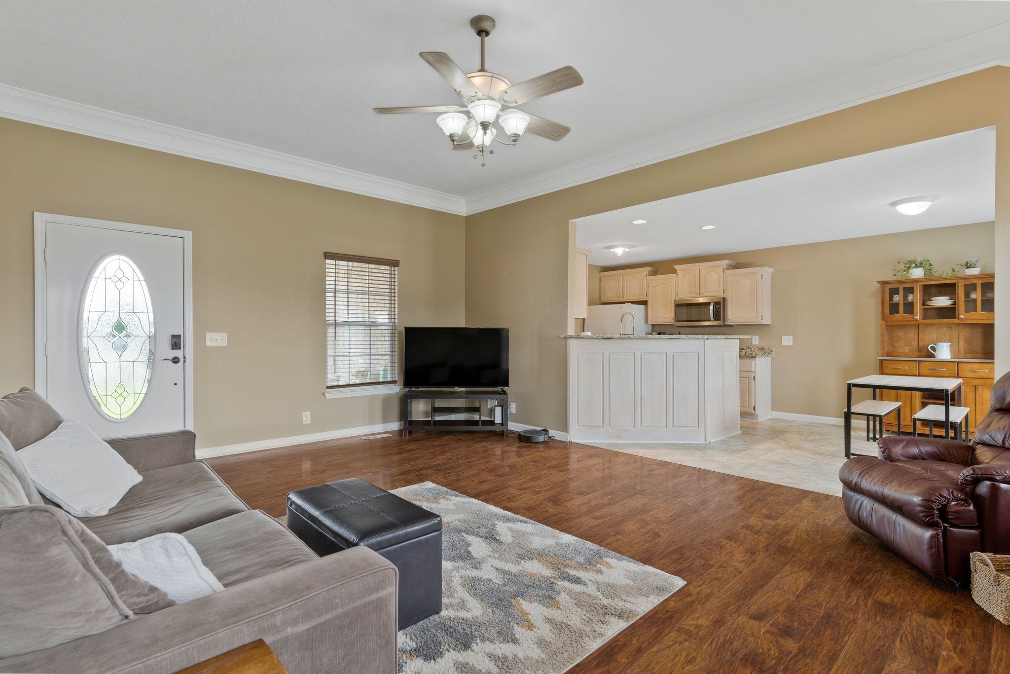 153 Cornerstone Boulevard Portland, TN 37148 - Photo 7 of 30 a living room with furniture and a flat screen tv with kitchen view