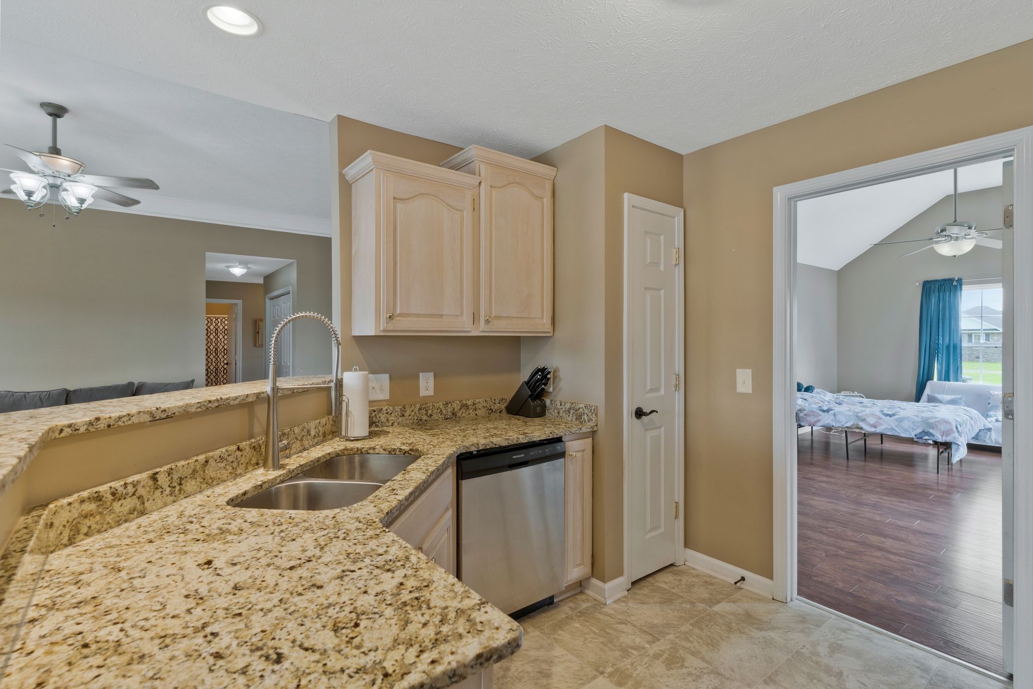 153 Cornerstone Boulevard Portland, TN 37148 - Photo 10 of 30 a kitchen with stainless steel appliances granite countertop a sink stove and refrigerator