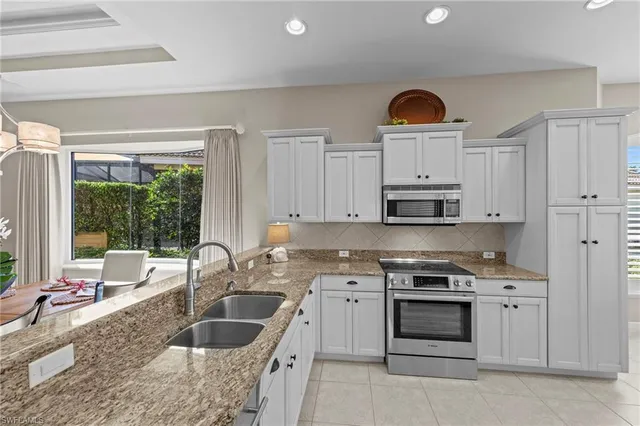 $895,000 | 9230 Troon Lakes Drive, Naples, FL 34109