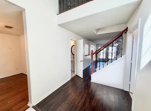 a view of entryway with wooden floor