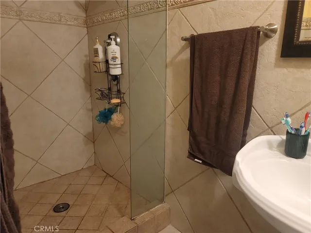 a kitchen with stainless steel appliances a stove a sink and a microwave