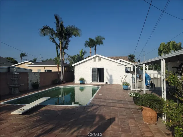 a view of swimming pool with seating space