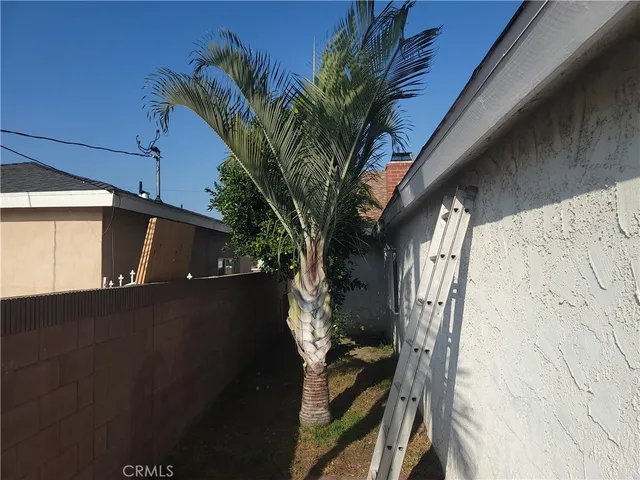 a view of a house with backyard porch and sitting area